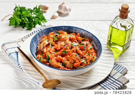 zucchini in a creamy tomato sauce, top view zucchini in a creamy tomato sauce, top view 78423826