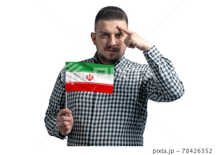 White guy holding a flag of Iran and a finger touches the temple on the head isolated on a white background 78426352
