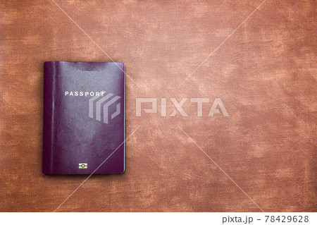 top view image of blank Passport on brown leather background texture with copy space, travel,tourist,document,indentification concept modern design top view image of blank Passport on brown leather background texture with copy space, travel,tourist,document,indentification concept modern design 78429628