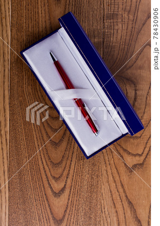 Red pen in a blue gift box. Red pen in a blue gift box. 78430906