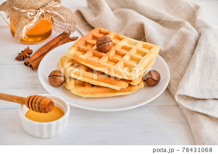 Stack of Belgian waffles on a white plate. Stack of Belgian waffles on a white plate. 78431068