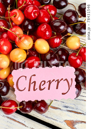 Delicious summer cherries on wooden background. 78431546
