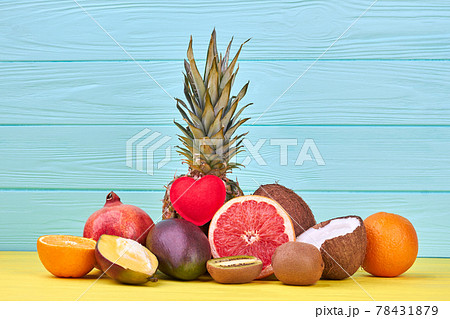 Assorted exotic fruits on blue background. 78431879