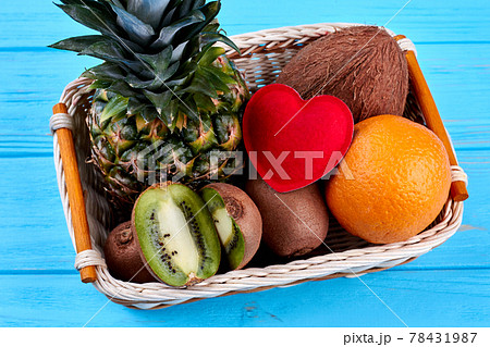 Composition from tropical fruits and red heart. 78431987