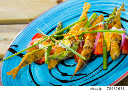 Battered sprats with creamy ginger sauce, tomatoes, balsamic Battered sprats with creamy ginger sauce, tomatoes, balsamic 78432638