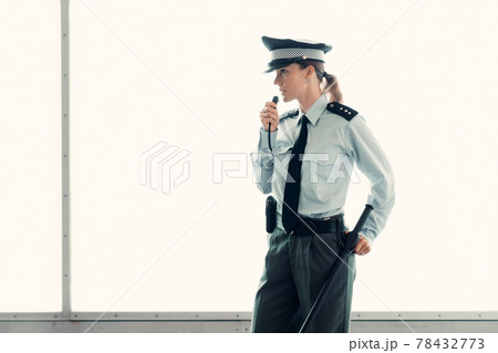 young woman female police officer on duty young woman female police officer on duty 78432773