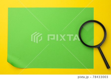 black magnifier on a yellow background. The concept of uncertainty and the search for solutions 78433003