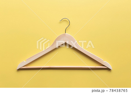 Black Friday, clothing industry concept on yellow background with wooden hanger 78438765