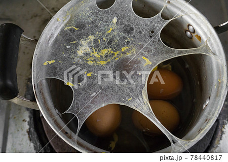 Exploding boiled eggs in a dirty pot on a dirty gas stove Exploding boiled eggs in a dirty pot on a dirty gas stove 78440817