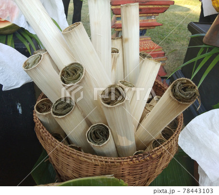 Sweet snack thai style Khao Lam or Glutinous sticky rice soaked in coconut milk and roasted baked in bamboo stem for sale at local shop Thailand Sweet snack thai style Khao Lam or Glutinous sticky rice soaked in coconut milk and roasted baked in bamboo stem for sale at local shop Thailand 78443103