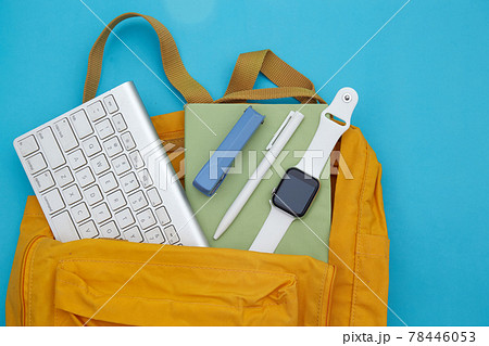 School backpack and school supplies on blue background. Back to school concept.	 78446053