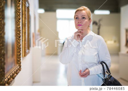 Closeup on mature female visiting museum Closeup on mature female visiting museum 78446085