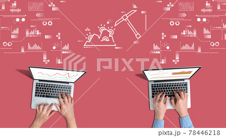 A team of crypto miners work on laptops 78446218