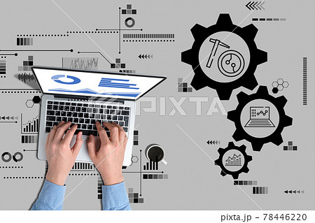 A person through a laptop controls the work of mining farms for the production of cryptocurrency A person through a laptop controls the work of mining farms for the production of cryptocurrency 78446220