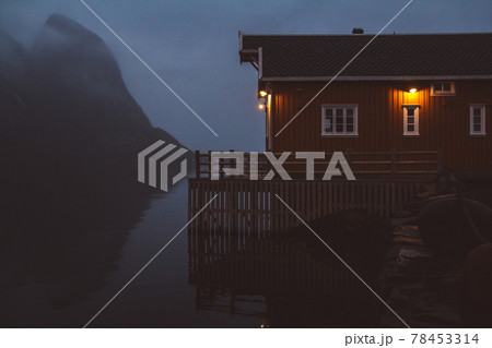 Norway rorbu houses and mountains rocks over fjord landscape scandinavian travel view Lofoten islands. Night landscape. 78453314