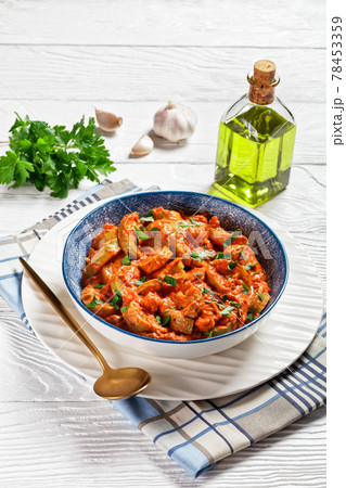 zucchini in a creamy tomato sauce, top view zucchini in a creamy tomato sauce, top view 78453359