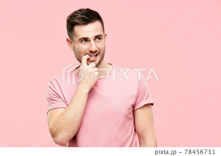 Funny pensive man have doubts making decision looking to copy space on pink background Funny pensive man have doubts making decision looking to copy space on pink background 78456731