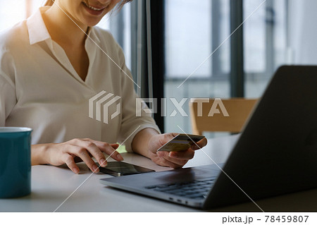 Enjoy wonan's hands typing mobile keyboard and holding credit card online shopping 78459807