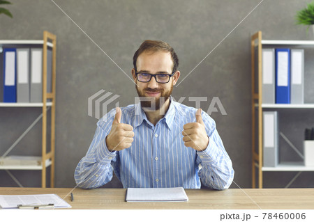 Happy young businessman or office worker showing that he's satisfied with work results 78460006