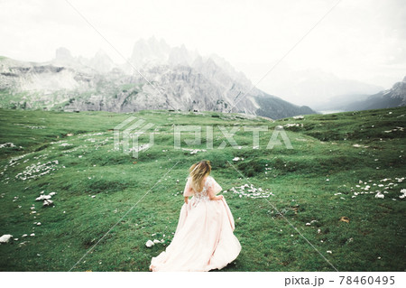 Beauty woman, bride with perfect white dress background mountains 78460495