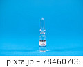 Invention vaccine from 2019-nCoV. Glass ampoules for injection with coronavirus vaccine on blue background with space for text. Concept of fighting Sars-nCov, vaccinating people against Covid19 virus 78460706