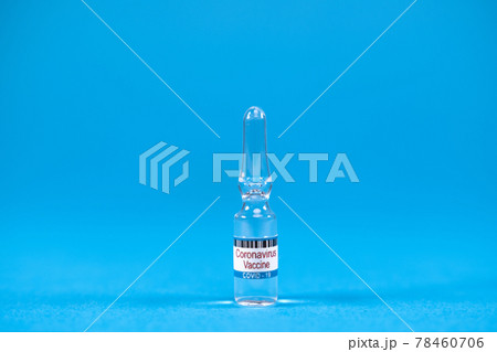 Invention vaccine from 2019-nCoV. Glass ampoules for injection with coronavirus vaccine on blue background with space for text. Concept of fighting Sars-nCov, vaccinating people against Covid19 virus 78460706