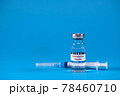 Vaccine for treatment of COVID-19 coronavirus with syringe on blue background with space for text. World vaccination against SARS-nCoV epidemic. Concept fighting and defeating coronavirus 2019-nCoV. 78460710
