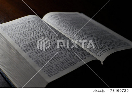 Open christian Bible on a wooden Slate Table Open christian Bible on a wooden Slate Table 78460726