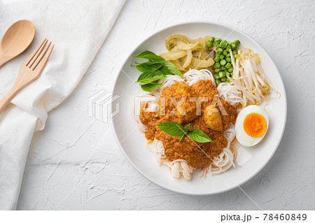Rice noodles in fish curry sauce with meatball and vegetable (Kanom Jeen Nam Ya).Top view Rice noodles in fish curry sauce with meatball and vegetable (Kanom Jeen Nam Ya).Top view 78460849