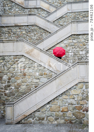Red umbrella on the beautiful stairs to Bratislava castle, Slovakia. Red umbrella on the beautiful stairs to Bratislava castle, Slovakia. 78462106