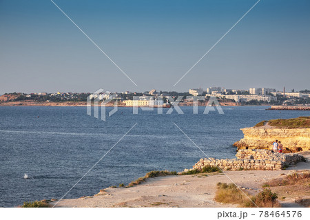 Awesome sunset over ruins of ancient city Tauric Chersonese - national historical and archaeological reserve. 78464576