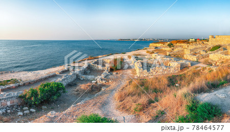Awesome sunset over ruins of ancient city Tauric Chersonese - national historical and archaeological reserve. 78464577