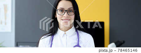 Portrait of female doctor with stethoscope around her neck in office 78465146