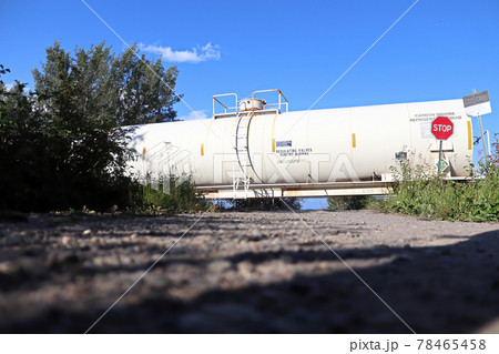 A train speeds past a stop sign at a crossing A train speeds past a stop sign at a crossing 78465458
