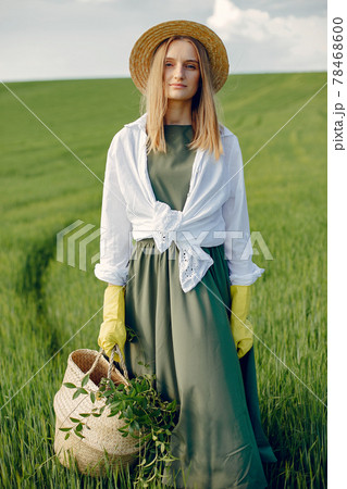 Elegant and stylish girl in a summer field 78468600