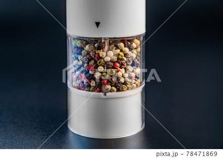 electric pepper shaker with peas on a black background. electric pepper shaker with peas on a black background. 78471869
