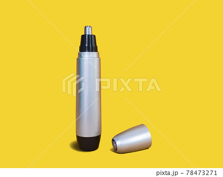 Opened Nose Trimmer isolated on yellow background. Back side standing position. Black and silver color. 78473271