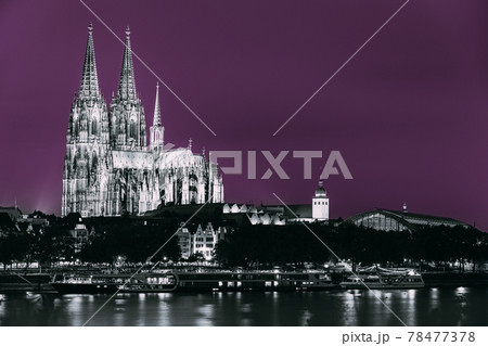Cologne, Germany. Night View Of Cologne Cathedral. Catholic Gothic Cathedral In Night. UNESCO World Heritage Site. Toned Photo Black, White And Ultra Violet Colors 78477378