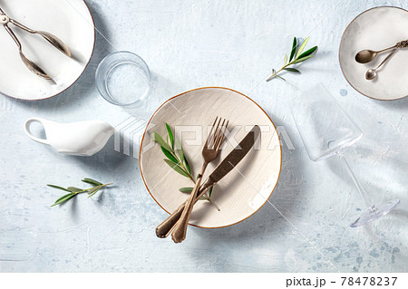 Modern tableware, overhead flat lay shot with olive branches 78478237