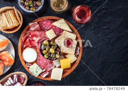 Charcuterie and cheese board with wine, overhead flat lay shot Charcuterie and cheese board with wine, overhead flat lay shot 78478249