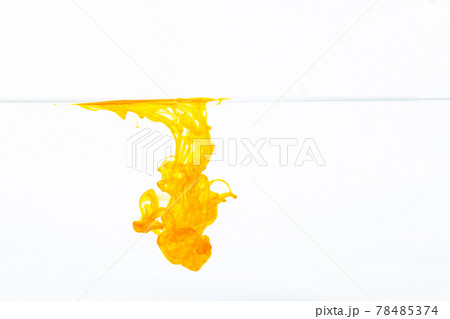 Yellow ink splashes into the water. Yellow ink splashes into the water. 78485374
