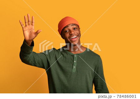 Hello. Portrait Of Friendly Young African American Guy Waving Hand At Camera 78486001