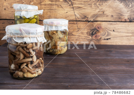 Preservation of vegetables in banks. Fermentation products. Harvesting mushrooms for the winter. Copy space. Preservation of vegetables in banks. Fermentation products. Harvesting mushrooms for the winter. Copy space. 78486682