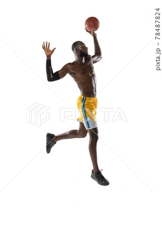 Full length portrait of a basketball player with a ball isolated on white studio background. advertising concept. Fit african american athlete jumping with ball. 78487824