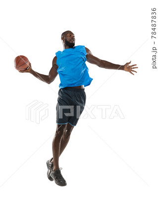 Full length portrait of a basketball player with a ball isolated on white studio background. advertising concept. Fit african american athlete jumping with ball. 78487836