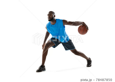 Full length portrait of a basketball player with a ball isolated on white studio background. advertising concept. Fit african american athlete jumping with ball. 78487850