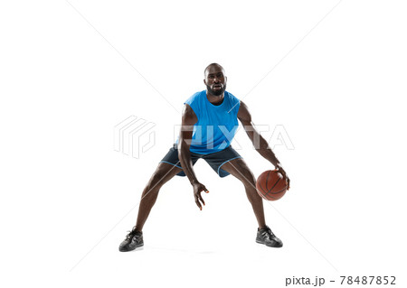 Full length portrait of a basketball player with a ball isolated on white studio background. advertising concept. Fit african american athlete jumping with ball. 78487852