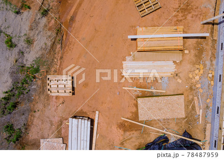 Stacked wooden building materials a stack of boards wood frame and beam construction Stacked wooden building materials a stack of boards wood frame and beam construction 78487959