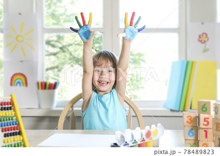Funny child boy shows hands dirty with paint. Funny child boy shows hands dirty with paint. 78489823