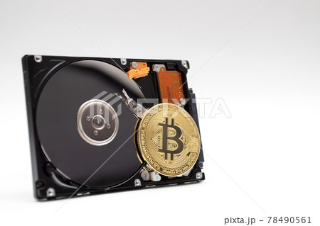 Coin of bitcoin with HDD. Mining Cryptocurrency coin on HDD Coin of bitcoin with HDD. Mining Cryptocurrency coin on HDD 78490561